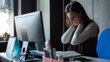 Fatigued woman at computer 